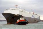 ID 2652 HUAL INGRITA (1980/33369grt/IMO 7900211, ex-INGRITA. Renamed HUAL TRUBADOUR, HOEGH TRUBADOUR. Scrapped 2010) sailing from Southampton, England. The tug is Howard Smith's FLYING OSPREY (1976/243grt/IMO...